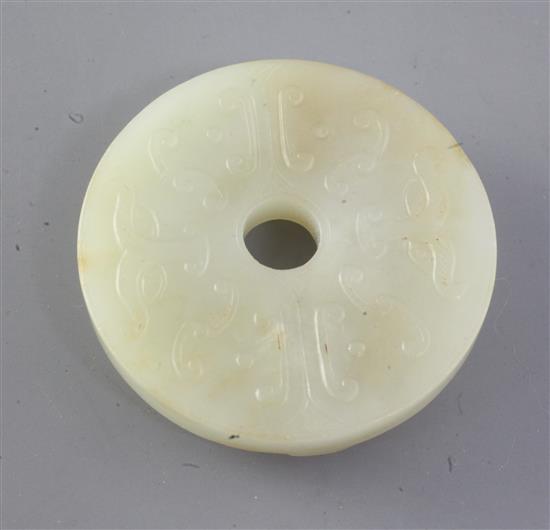 A Chinese pale celadon jade bi disc, 19th century diameter 5.4cm